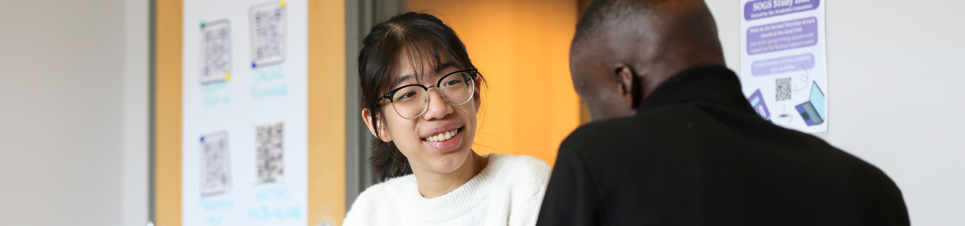 Several people working in the writing support centre.