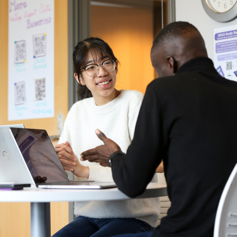 Several people working in the writing support centre.